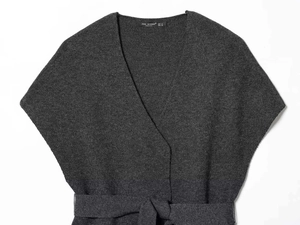 Macro detail of dark grey V-neck knitwear featuring fine texture and matching waist tie