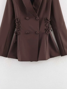 Detail of dark brown double-breasted blazer with adjustable waist side tie design