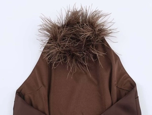 Detail of elegant dark brown halter neck dress featuring luxurious feather trim on collar