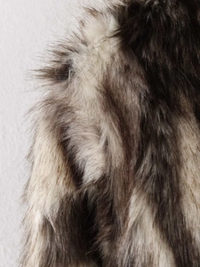 Close-up of thick faux fur texture with grey and brown gradient for winter coats