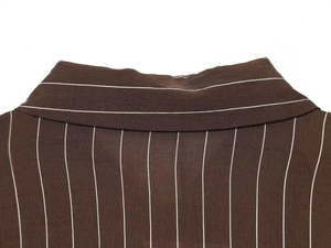 Close-up of the vintage brown striped shirt collar showing detailed fabric texture and stitching