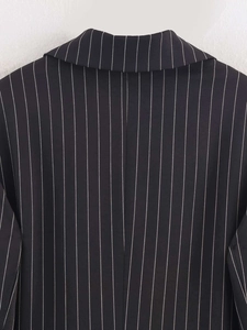 Detail view of classic striped blazer collar with high-quality twill fabric texture