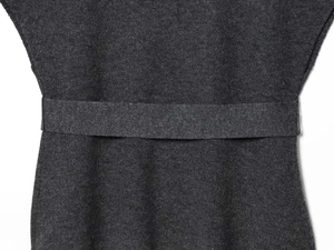 Close-up of dark grey knitted fabric texture and matching waist belt detail