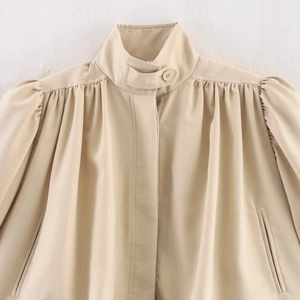 Beige stand collar jacket with ruched shoulders and hidden placket for autumn