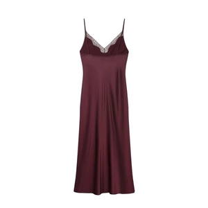Detail of red satin dress featuring delicate black lace trim at the V-neckline