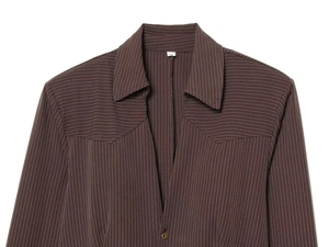Detail of dark coffee striped shirt featuring a classic pointed collar and V-shaped stitching