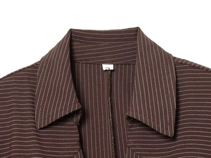 Close-up of brown pinstripe shirt collar with padded shoulders and size S tag