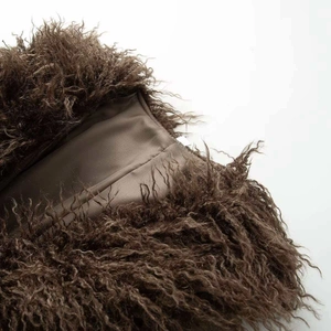 Close-up of the plush brown faux fur texture and smooth inner lining of the coat