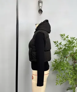 Side view of a short black hooded puffer vest shown on a white mannequin torso