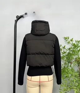Detailed back view of a black padded hooded vest featuring horizontal quilting for winter