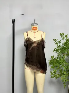 Detail of brown silk camisole featuring black floral lace trim and asymmetrical hemline