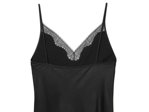 Detail showing delicate black eyelash lace trim and V-neckline of a satin camisole top