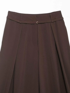 Detail view of brown high-waisted wide-leg pants with a slim belt and golden buckle