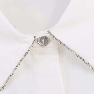 White poplin shirt collar detail with silver beaded trim and translucent button