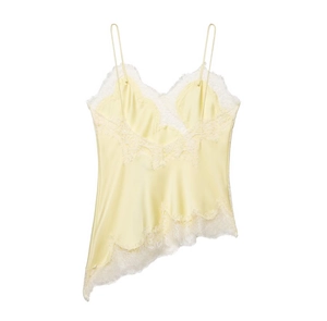 Close-up of light yellow satin camisole with white lace trim and irregular hem detail