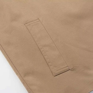 Minimalist khaki belted short jacket featuring clean stitching and cotton blend texture