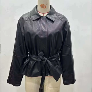 Women's black faux leather jacket featuring a lapel collar and stylish waist tie belt