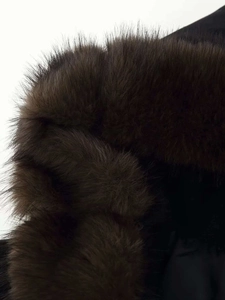 Detailed macro view of soft dark brown faux fur trim on a winter hooded wool coat