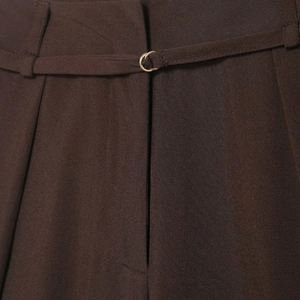 Women's brown wide-leg trousers with matching slim belt and golden metal ring buckle