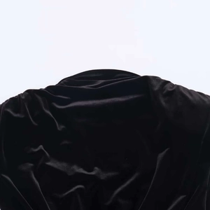 Chic black velvet mini dress with elegant shoulder pads and soft glossy fabric texture