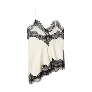 Detail of white satin camisole featuring black eyelash lace and asymmetric hemline