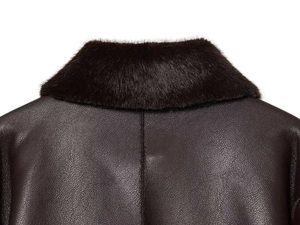 Detail view of premium dark brown leather jacket with plush faux fur collar and stitching