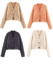 Detail view of four colors of fuzzy V-neck knit cardigans with soft mohair texture