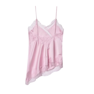 Close-up of pink satin camisole featuring delicate lace trim and asymmetric hemline