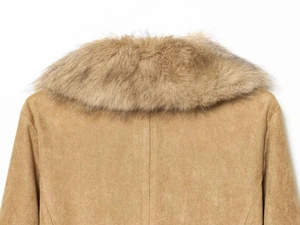 Detail of soft tan faux suede fabric and plush fur collar on a stylish winter jacket