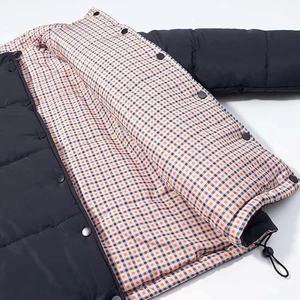 Loose fit black puffer jacket for women with contrasting classic plaid lining detail