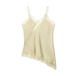 Detailed view of light green satin camisole with delicate eyelash lace trim and adjustable straps