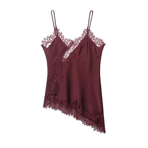 Close-up of wine red lace patchwork satin camisole with asymmetric lace hem details