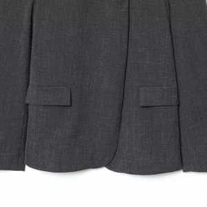 Dark grey minimalist blazer jacket featuring flap pockets and smooth fabric texture