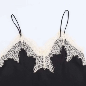 Elegant black satin camisole featuring white eyelash lace trim and thin straps