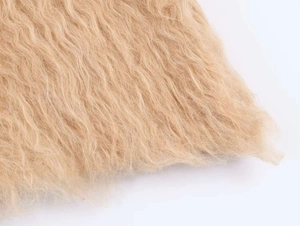 Macro shot of plush V-neck knit sweater featuring soft faux fur curly wave texture