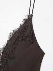 Detail of silk satin dark brown camisole with delicate eyelash lace trim and thin straps