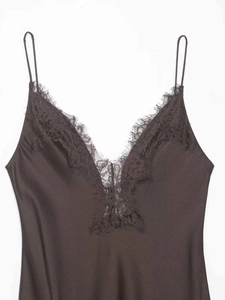 Close-up of elegant V-neckline with delicate eyelash lace trim on satin dress