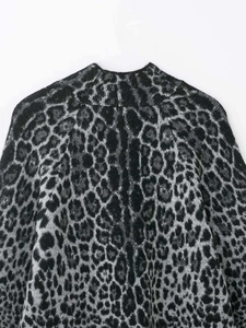 Detail of mock neck leopard print mohair sweater with soft textured knit fibers