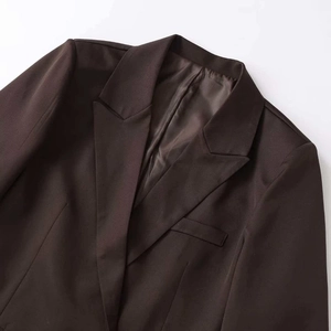 Deep brown double-breasted blazer for women featuring a notch lapel and a loose fit cut