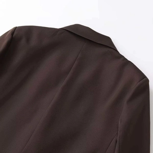 Deep brown loose fit double-breasted blazer showing back collar and shoulder detail