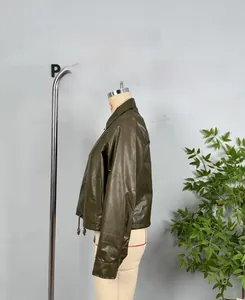Detail view of deep olive green faux leather jacket featuring drawstring hem and zip closure