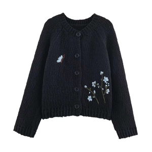 Classic black knitted cardigan featuring delicate floral and butterfly embroidery details