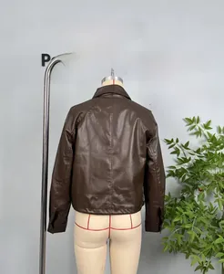 Detail view of the back seams and drawstring hem on a dark brown faux leather jacket