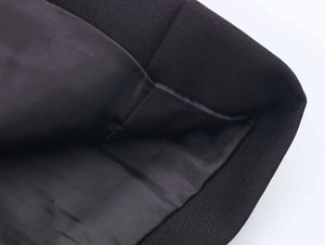 Close-up of the black satin lining and premium twill fabric on this blazer jacket