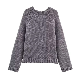 Close-up of the grey crewneck sweater showing thick knit texture and flower embroidery