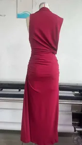 Detail view of the elegant pleated design and back texture of a red sleeveless maxi dress