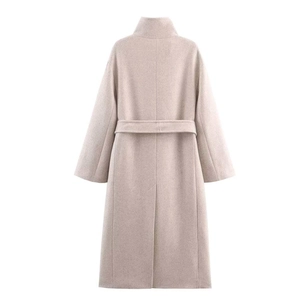 Detail view of high collar wool coat back featuring a waist belt and back vent slit