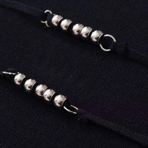 Slim fit halter knit vest with elegant silver bead trim and black textured fabric