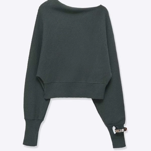 Deep grey off-shoulder knit sweater with decorative silver rings on the sleeves