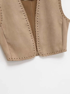 Detailed view of the camel faux suede vest with refined braided edge stitching craftsmanship